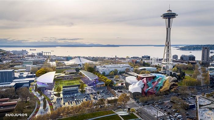 西雅图中心的照片，前景是多个公共建筑，背景是一片广阔的水域——一个双面体育场被数字技术添加了一个运动场