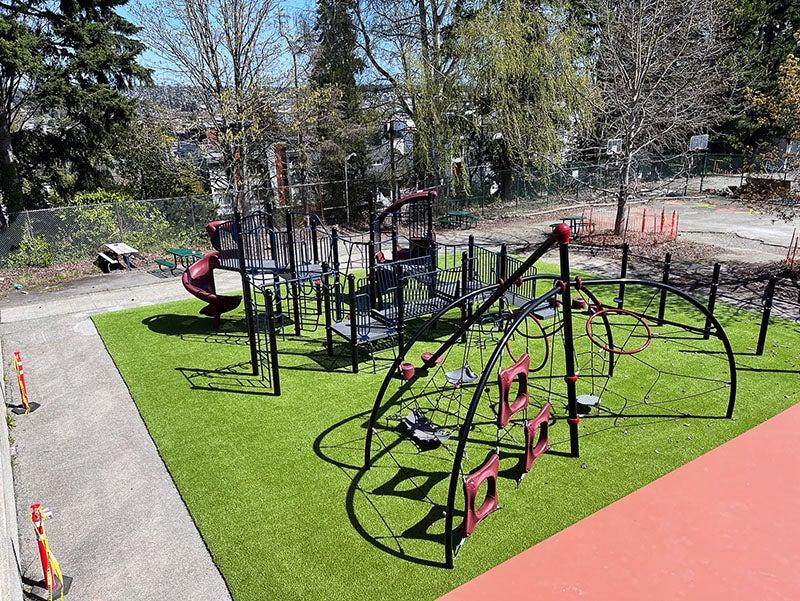 outdoor play structures site on artificial turf